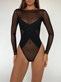 A black bodysuit with long sleeves and a provocative pattern covering the chest, modeled by a person.