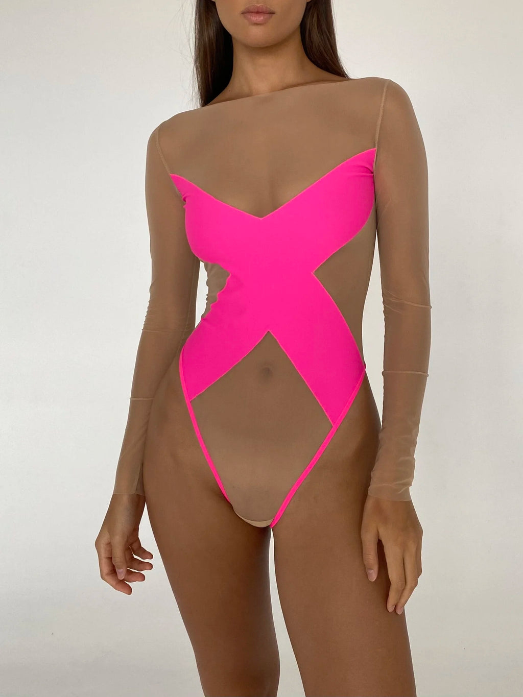 A model wearing a translucent bodysuit with a provocative pattern on the chest in pink color.