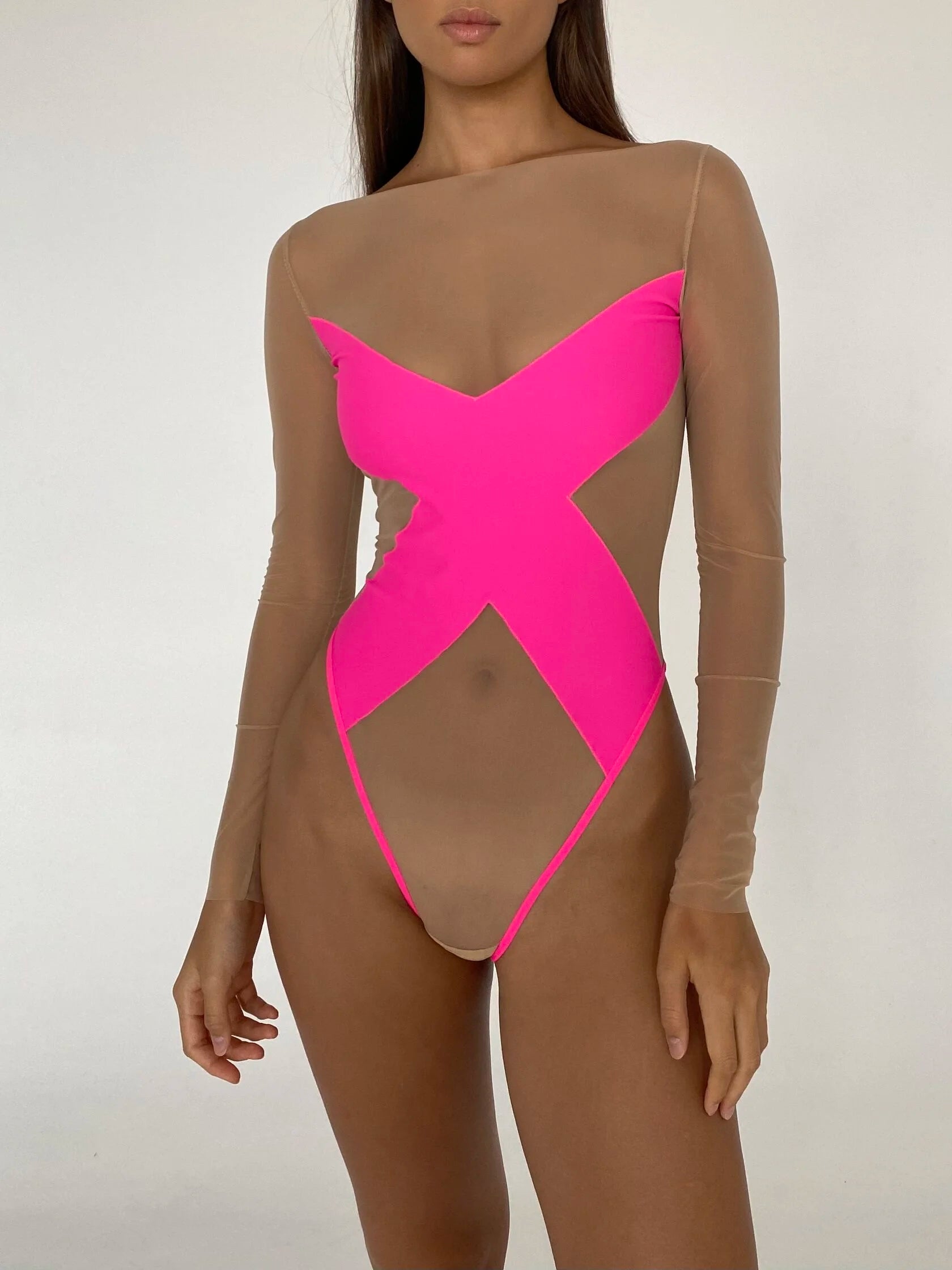 A model wearing a translucent bodysuit with a provocative pattern on the chest in pink color.