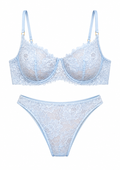 Light blue lace bra and panties set on a white background