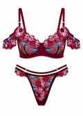Floral lingerie set with red bra and matching panties on a white background