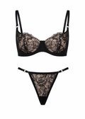 Black lace bra and thong set on a white background
