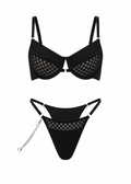 Black bikini set with mesh details on a white background